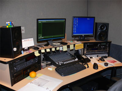 Nestor's computers and audio equipement. He splices all the announcments into the daily programs and uploads them to all the satelites and radio stations. 