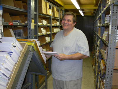 Mail room worker in the warehouse area 